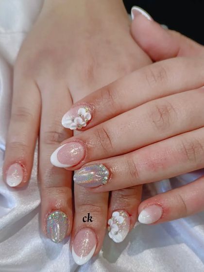 A stunning nude bridal set with ombre, chrome, 3D flowers, and rhinestone details.