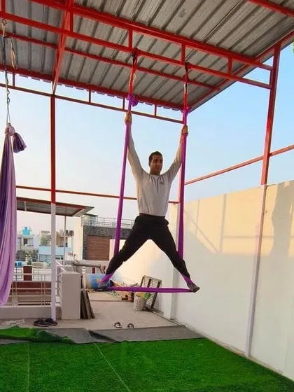 A student in a wide-legged pose, feeling the connection with the air element.
