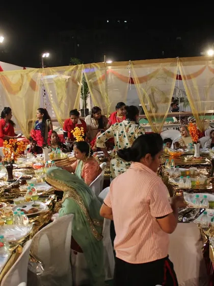 A candid shot of guests enjoying a meal at one of our events. Our goal is to create a lively and comfortable environment where everyone can celebrate together.
