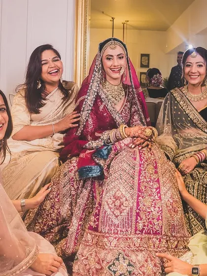 The bride, Bhavita, surrounded by her smiling bridesmaids. Capturing the joy and support of your bride tribe is a must.