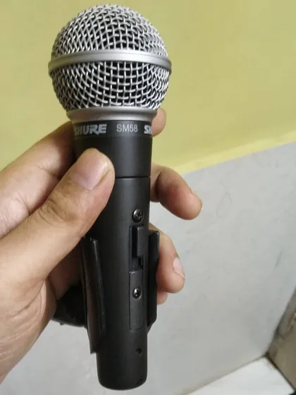 My trusted Shure SM58 microphone. Having professional gear is important for delivering clear, quality sound at every gig.