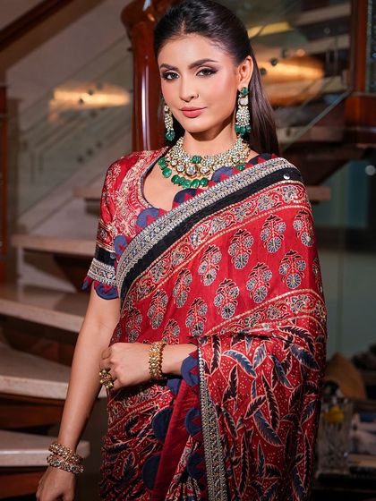 A striking portrait that captures the elegance of the saree and the beauty of the makeup. The look is a perfect example of modern Indian glamour.