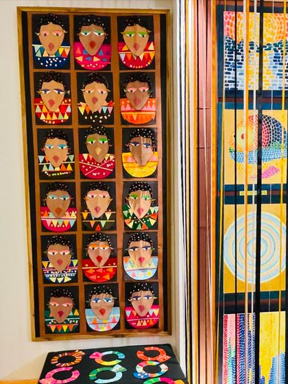 A panel displaying portraits inspired by African art, another highlight from our "Colours of Africa" exhibition. The variety of expressions and colors is fantastic.