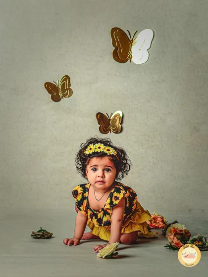 This little butterfly is exploring her world. We use simple, elegant props to create a storybook feel for our themed photoshoots.