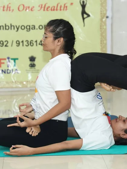 Pair yogasana is a beautiful practice of trust, balance, and connection. Here, two of our students demonstrate a complex posture during a competition, showcasing the strength and harmony that can be achieved when we practice together. It is a visual representation of support and unity.