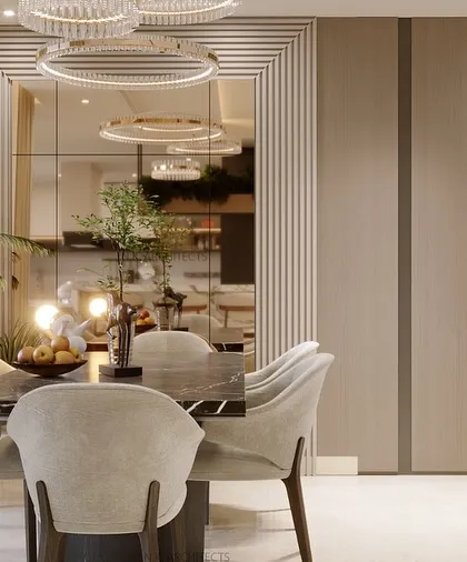 This living space is a serene haven, blending soft beige tones with light wooden textures. A modern, flowing chandelier adds a touch of elegance, creating the perfect balance of warmth and sophistication for a relaxed family area.