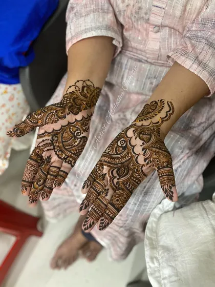 An Indo-Arabic design with a mix of bold and fine lines. The patterns are intricate and create a rich, textured look.
