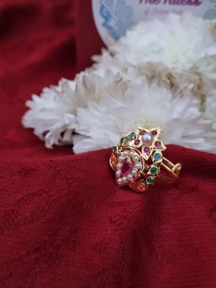 A side profile of the 'रेवा' (Reva) ring, showing the adjustable band.