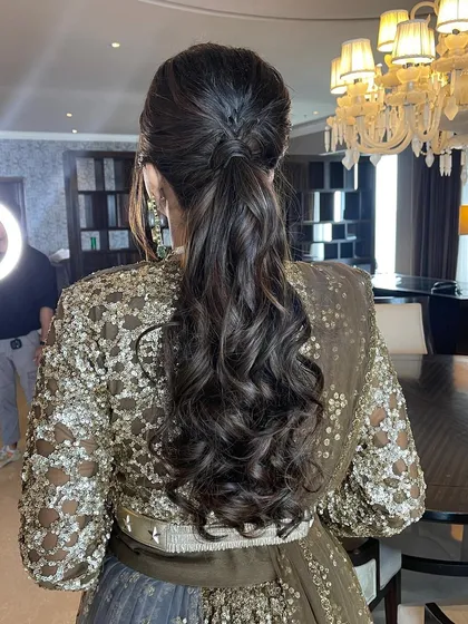 A fishtail braid incorporated into a high ponytail for a chic and modern look.