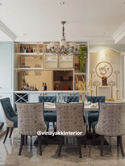 In many homes, the dining area is a multi-functional space. Here, I integrated a sophisticated bar counter and a serene pooja unit into the dining room design. This creates a harmonious environment that serves different needs, blending social gatherings with spiritual tranquility.