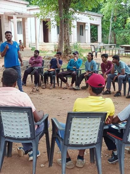 An instructor leads a discussion and debrief session with participants at our Ramanagara climbing camp.