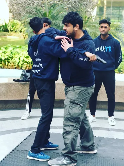 Here I am demonstrating a gun disarm from the side. The first and most critical step is to move your body out of the line of fire while simultaneously gaining control of the weapon.
