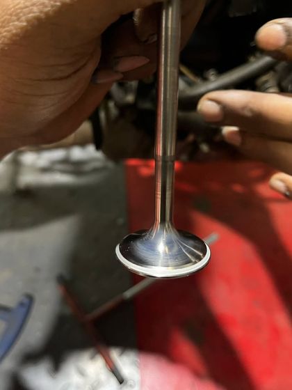 A detailed look at one of the brand new valves before installation in the Himalayan 411 engine.