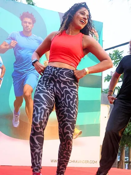 A high-energy Zumba warm-up session on stage at the UKG Unity Run. I incorporate dynamic activities like Zumba and Bhangra to ensure everyone is energized and ready to go.