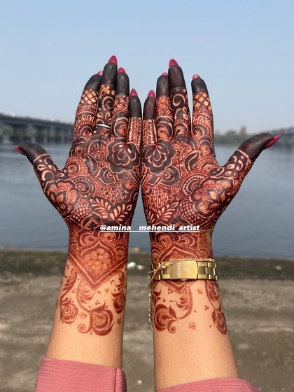 A beautiful dark stain on a floral design, photographed outdoors to show the true richness of the color against the skin.