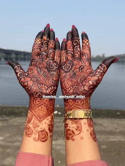 A beautiful dark stain on a floral design, photographed outdoors to show the true richness of the color against the skin.