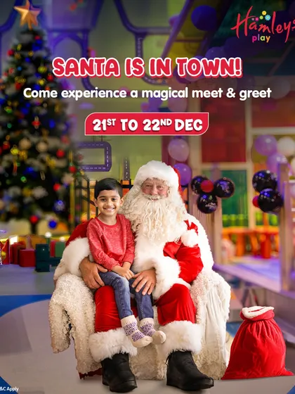 Santa is in town! This photo captures a heartwarming moment during our magical meet and greet, where a young guest gets to sit with Santa and share his Christmas wishes.