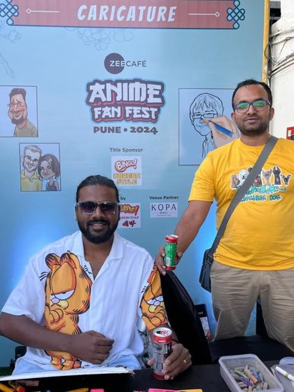 Here I am with a fellow artist at our caricature booth at the Anime Fan Fest at KOPA Mall.