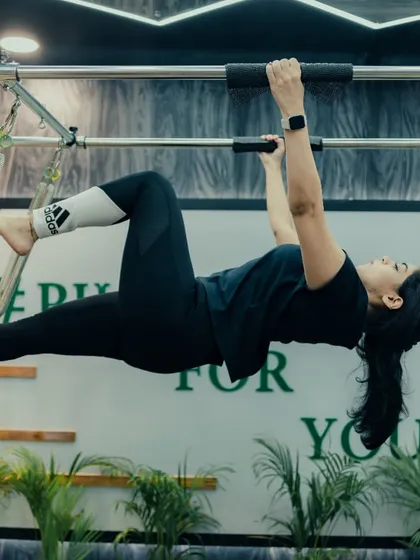 The Trapeze Tower allows for incredible full-body movements that decompress the spine and build functional strength. This hanging exercise is an advanced move that strengthens the core and improves shoulder stability.