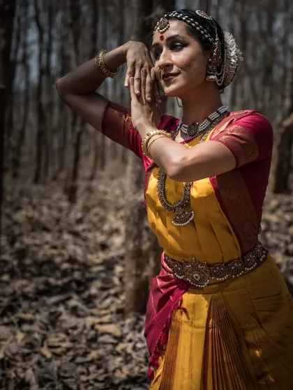 A portrait taken in the woods. The natural setting provides a beautiful contrast to the structured form of classical dance, highlighting its organic qualities.
