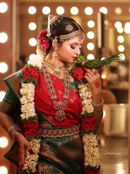 This portrait captures the bride in a moment of reflection, with the studio lights creating a warm and intimate atmosphere.