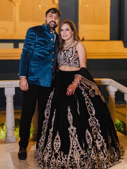 The couple, looking sharp and stylish. Her makeup is designed to last all night through dancing and celebrations.