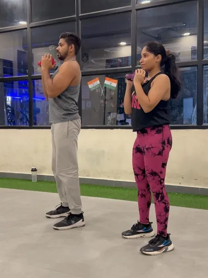 A complete leg workout you can do at home. Here we are demonstrating proper form for dumbbell squats to build strength in your quads and glutes.