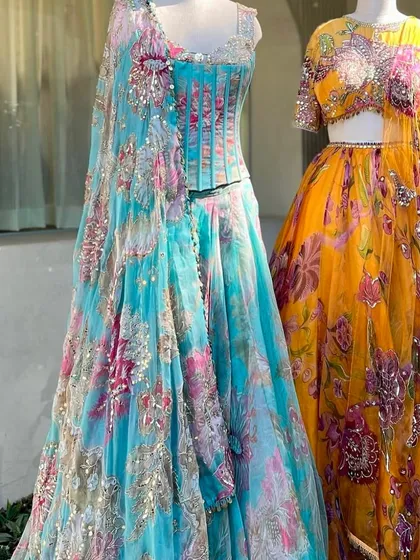 Why settle for one look when you can have options? Our collection for Haldi and Sangeet includes a wide variety of floral prints and vibrant colors, like these turquoise and yellow designer-inspired lehengas. I can even create matching outfits for the couple.