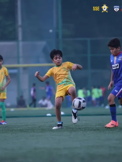 A player controlling the ball with his knee, a display of technical skill.