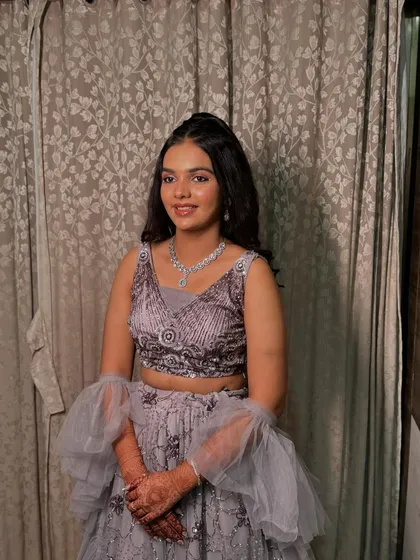 Another one of her looks for her sister's wedding, showcasing her versatile style.