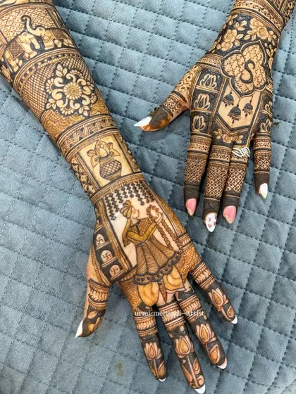 The other hand of the same design, featuring a kalash (pot) and other auspicious symbols.