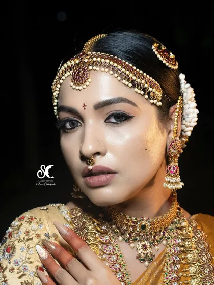 A close-up of a royal bridal look, focusing on the dramatic winged eyeliner and perfectly blended eyeshadow. Mastering eye makeup is crucial, and I dedicate significant hands-on time in my course to perfecting these detailed techniques for a captivating result.