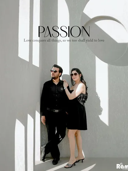 A cool and stylish couple portrait against a minimalist architectural background. The strong shadows and their confident poses give this pre-wedding shot a very modern and passionate vibe.