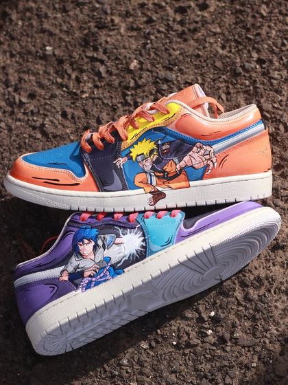 Another angle of the Naruto and Sasuke custom Jordans, showing the artwork on the outer side of both shoes.