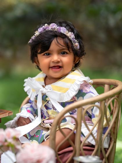 A close-up of this sweet girl at her garden tea party. The floral headband and detailed collar add such a lovely touch.