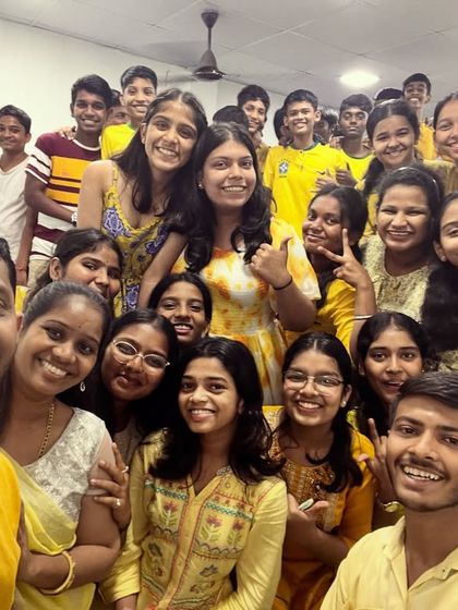 A bright and cheerful group selfie with everyone dressed in yellow for Day 4 of Navratri, spreading joy and positivity.