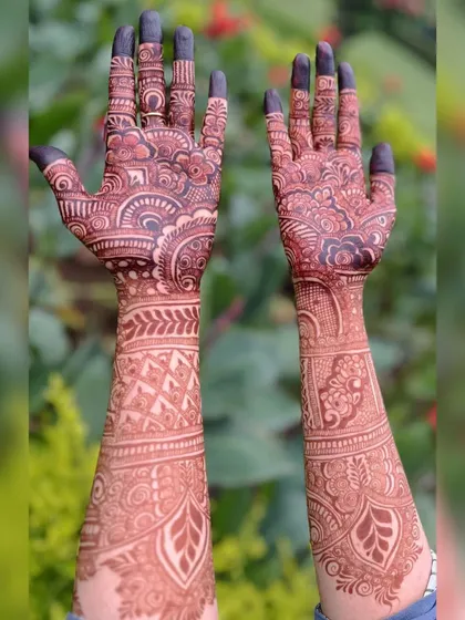 The beauty of a mature henna stain against a natural green background. The reddish-brown color is rich and vibrant, just as it should be.