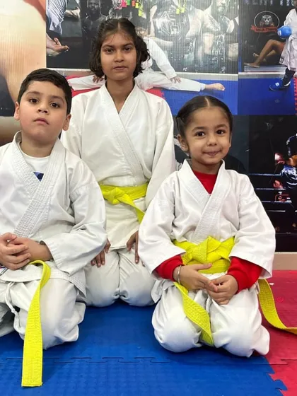 Three of our students, from beginner to intermediate, showing respect and discipline. This is the spirit of our dojo.