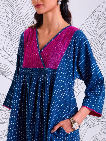 The Chaaya Indigo Dress, with its hand-block printed fabric and embroidered yoke, is a testament to slow fashion. It's a piece that feels good to wear, knowing it was made with care.