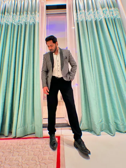 A full-length view of my sharp Sangeet attire. I believe in looking the part to deliver a premium experience.