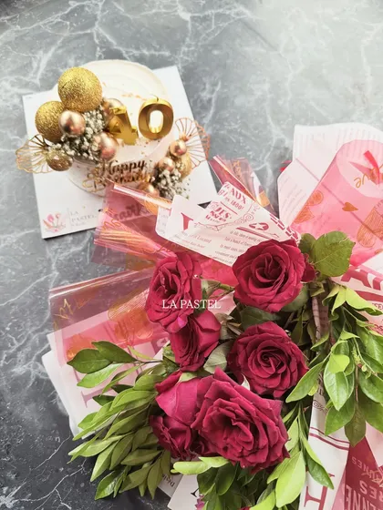 This classic gift combo includes a beautiful mini cake with a "40" topper and a fresh bouquet of red roses, perfect for a milestone birthday.