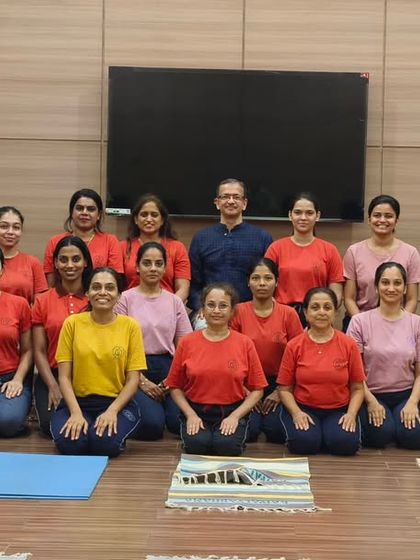 A group photo of students and their instructor after a fulfilling yoga session. This image reflects the sense of community and shared purpose that develops within my courses.