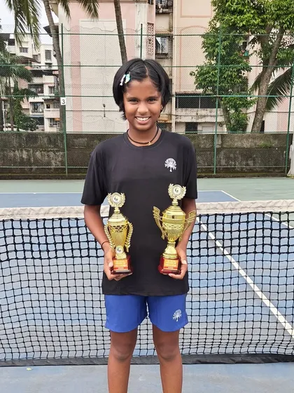 Tamanna Nair proudly displaying her two winner's trophies from the U-12 Super Series.