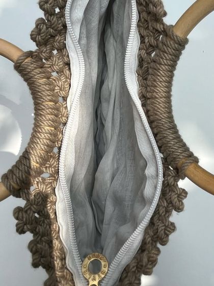 A look inside our new handbag design, showing the spacious interior with a zipper and inner pouch. It's designed to be both beautiful and practical.