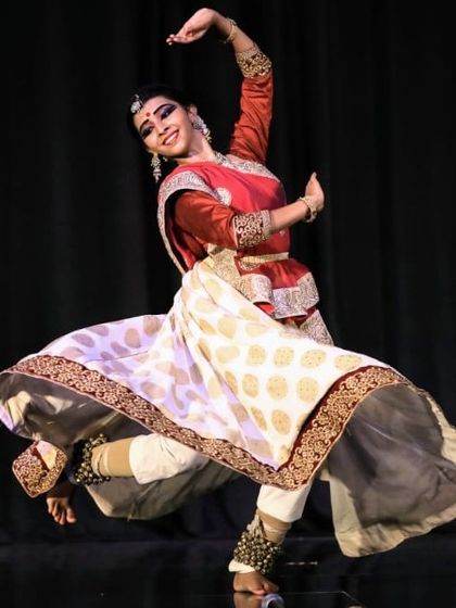This image captures the powerful storytelling aspect of Kathak, where every movement and expression conveys a narrative. This dancer is in the middle of a dynamic spin, showcasing the energy of the form.