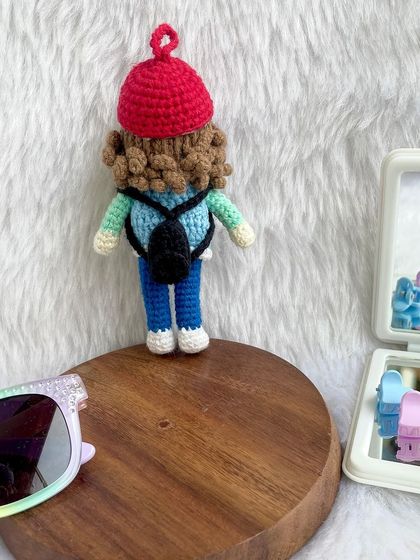 My first miniature replica doll, just 4 inches tall! This little adventurer comes with a red hat, a tiny backpack, and lots of personality. It shows that great things come in small packages.