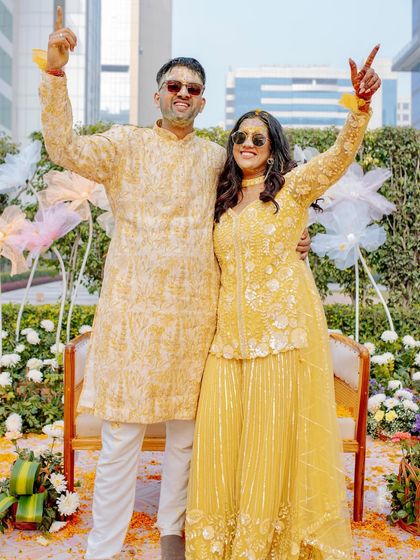 Pure happiness captured at the Haldi ceremony. The decor is designed to be the perfect backdrop for these unforgettable, fun-filled moments.