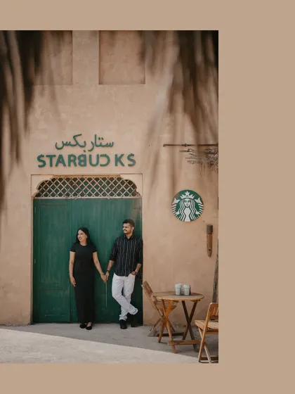 A unique pre-wedding shot from a destination shoot in Dubai, blending a familiar brand with rustic local architecture. I am available for destination pre-wedding shoots to tell your story anywhere in the world.