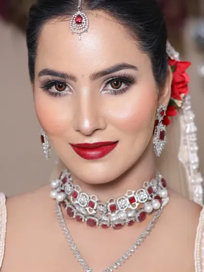 A classic red lip is timeless. In my course, you'll learn to create iconic bridal looks like this one, mastering everything from skin prep to the final touches for a radiant finish.