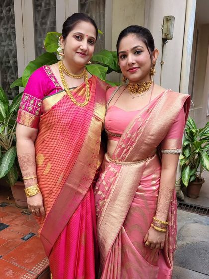 Draping for a mother and daughter duo. The daughter wears a modern body-hug drape in pink, while the mother is in a classic drape, showing how I cater to different style preferences.